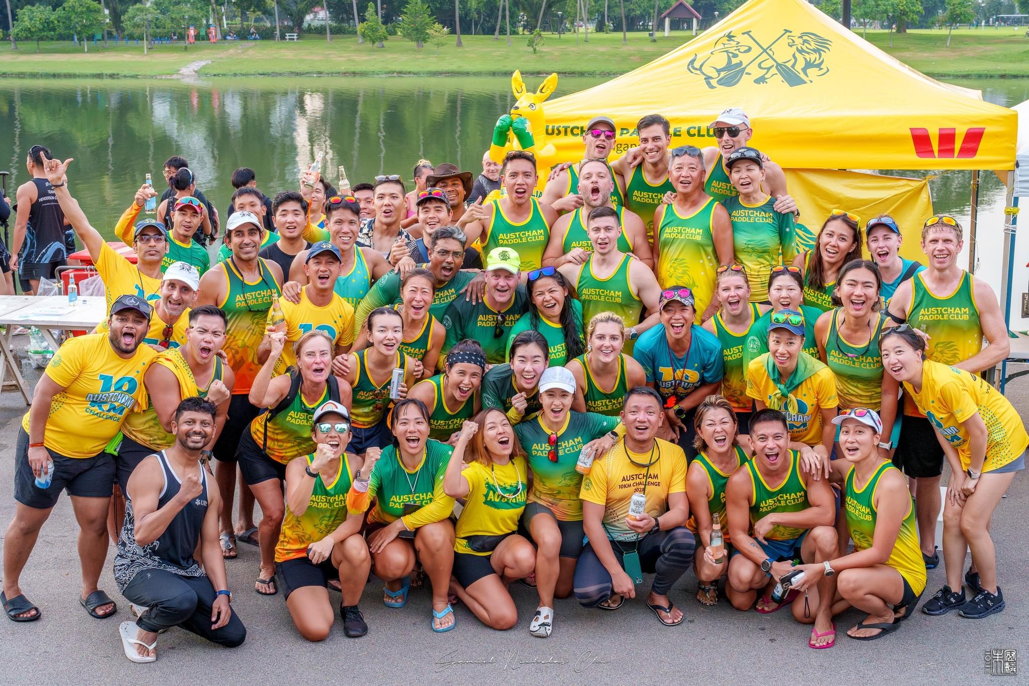 Austcham Paddle Club paddlers celebrating together at the 10km Challenge, 2024